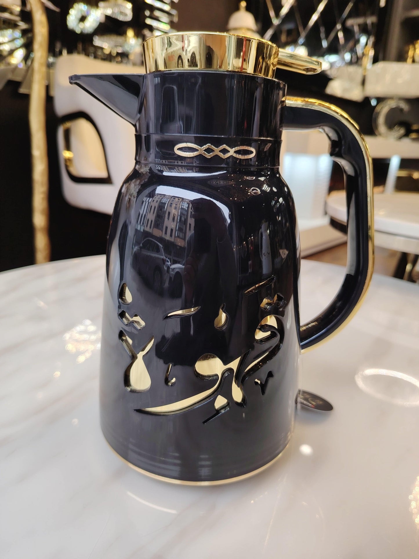 Thermos HomeDeLuxe pour lait et café, bouteille isolante en acier inoxydable, avec bouchon hermétique, visible dans l’image.