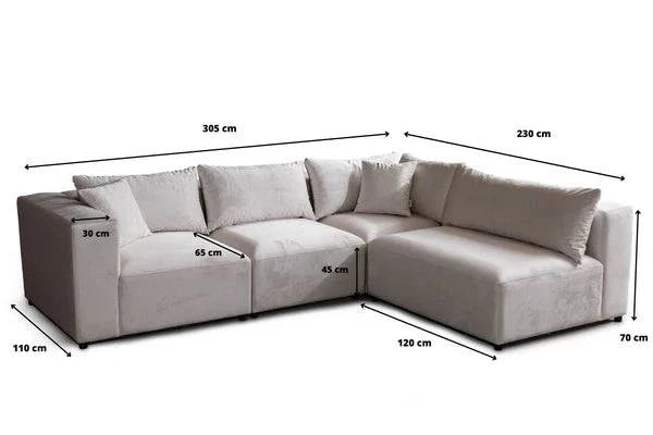 Canapé modulable Azra en velours blanc cassé de la marque HomeDeLuxe, vue d'angle montrant ses coussins confortables.