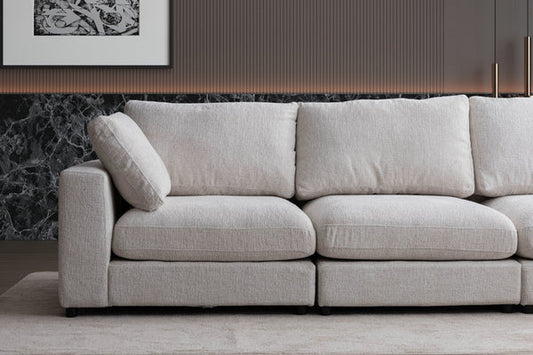 Canapé modulable Julia en chenille avec 4 places et pouf, mobilier moderne de marque HomeDeLuxe, assises confortables.