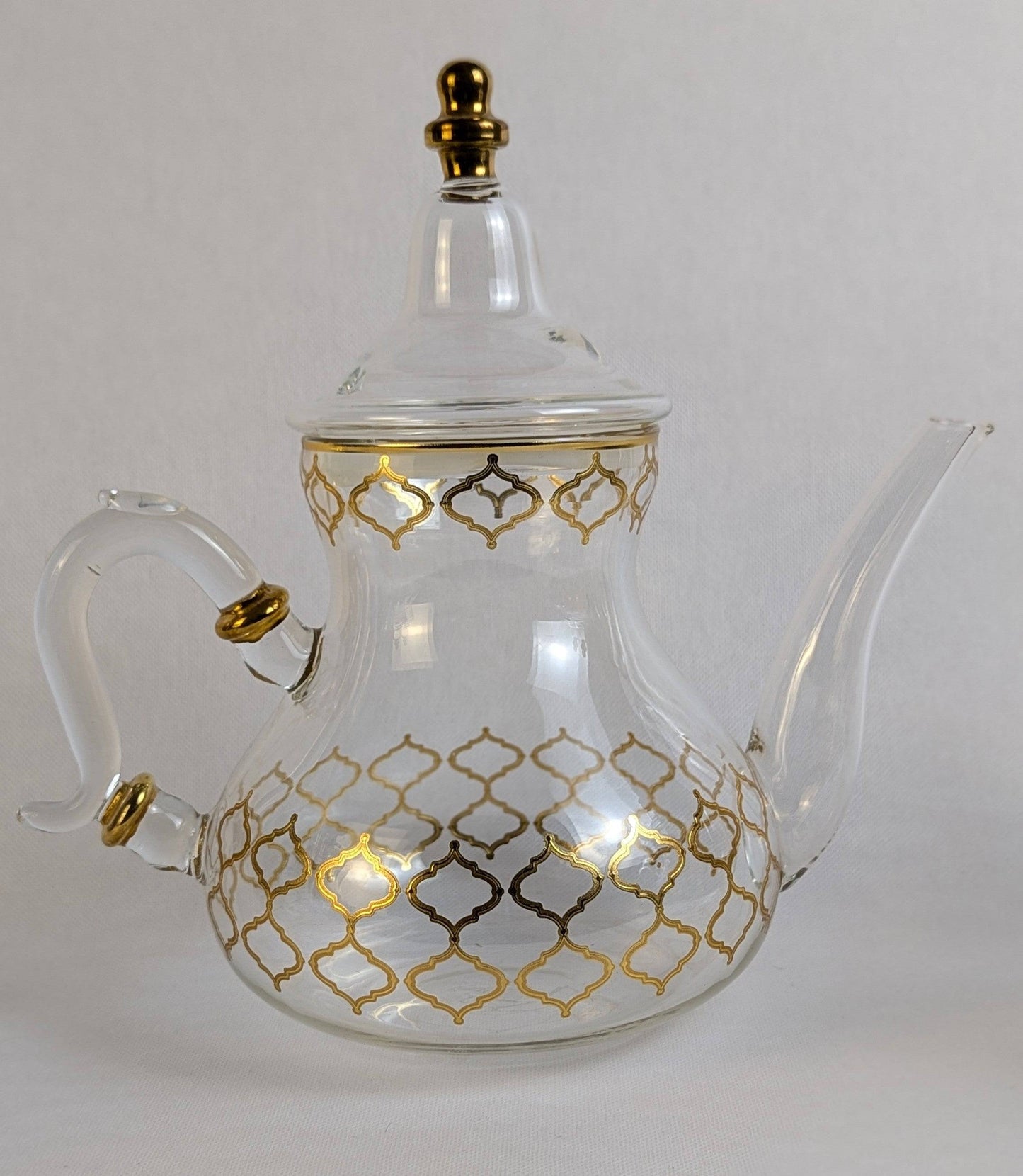 Théière en verre Fès de marque HomeDeLuxe, transparente, avec poignée en verre et design élégant pour infuser le thé.