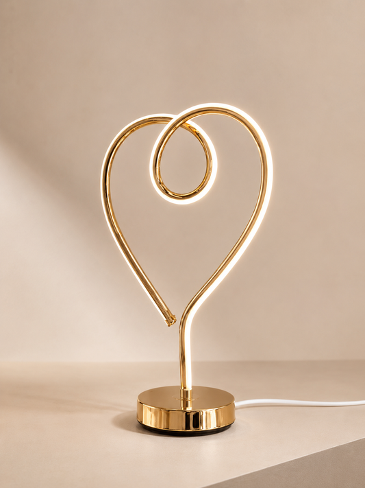 Lampe LED en forme de cœur de la marque HomeDeLuxe, illuminant avec une lumière douce et chaleureuse.