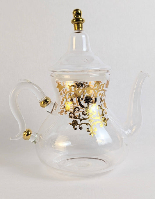 Théière en verre HomeDeLuxe Rabat dorée avec couvercle, design élégant et transparent, idéale pour infuser le thé.