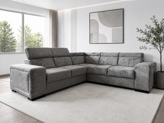 Canapé convertible Karola de HomeDeLuxe en tissu gris anthracite, avec accoudoirs rembourrés et coussins décoratifs.