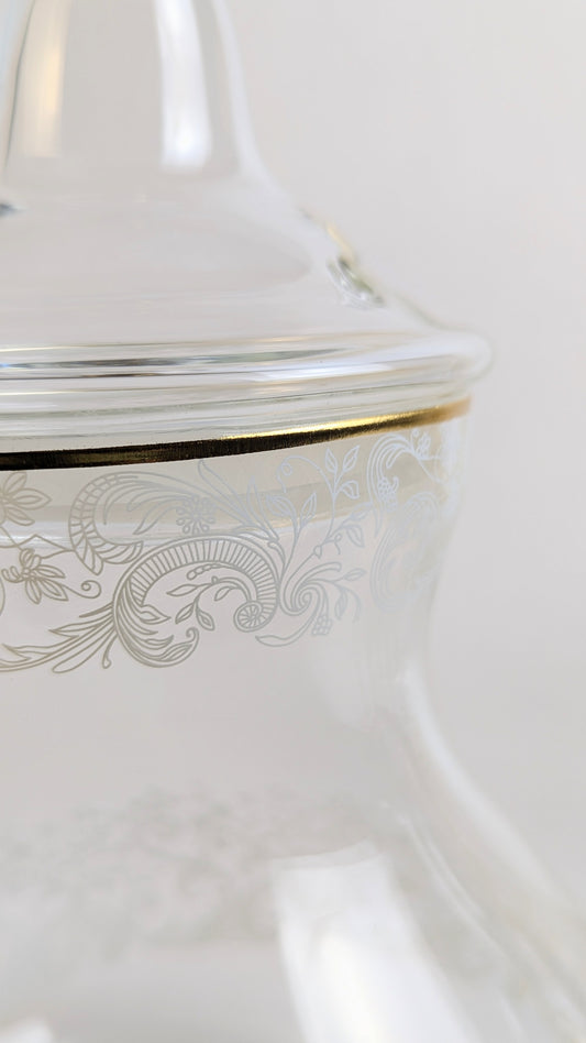 Théière en verre HomeDeLuxe avec motif blanc, transparente, élégante, idéale pour infuser le thé avec style.