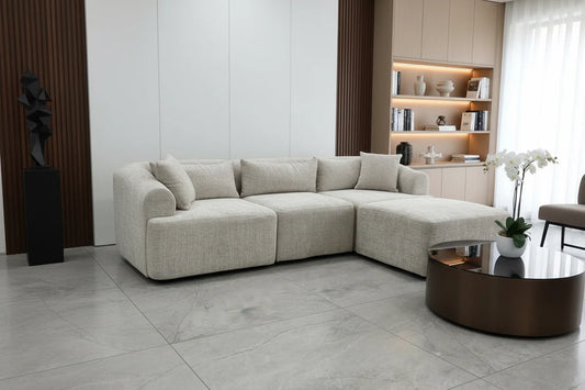 Canapé modulable Mila Marbella crème de marque HomeDeLuxe, assises et repose-tête visibles en tissu élégant.