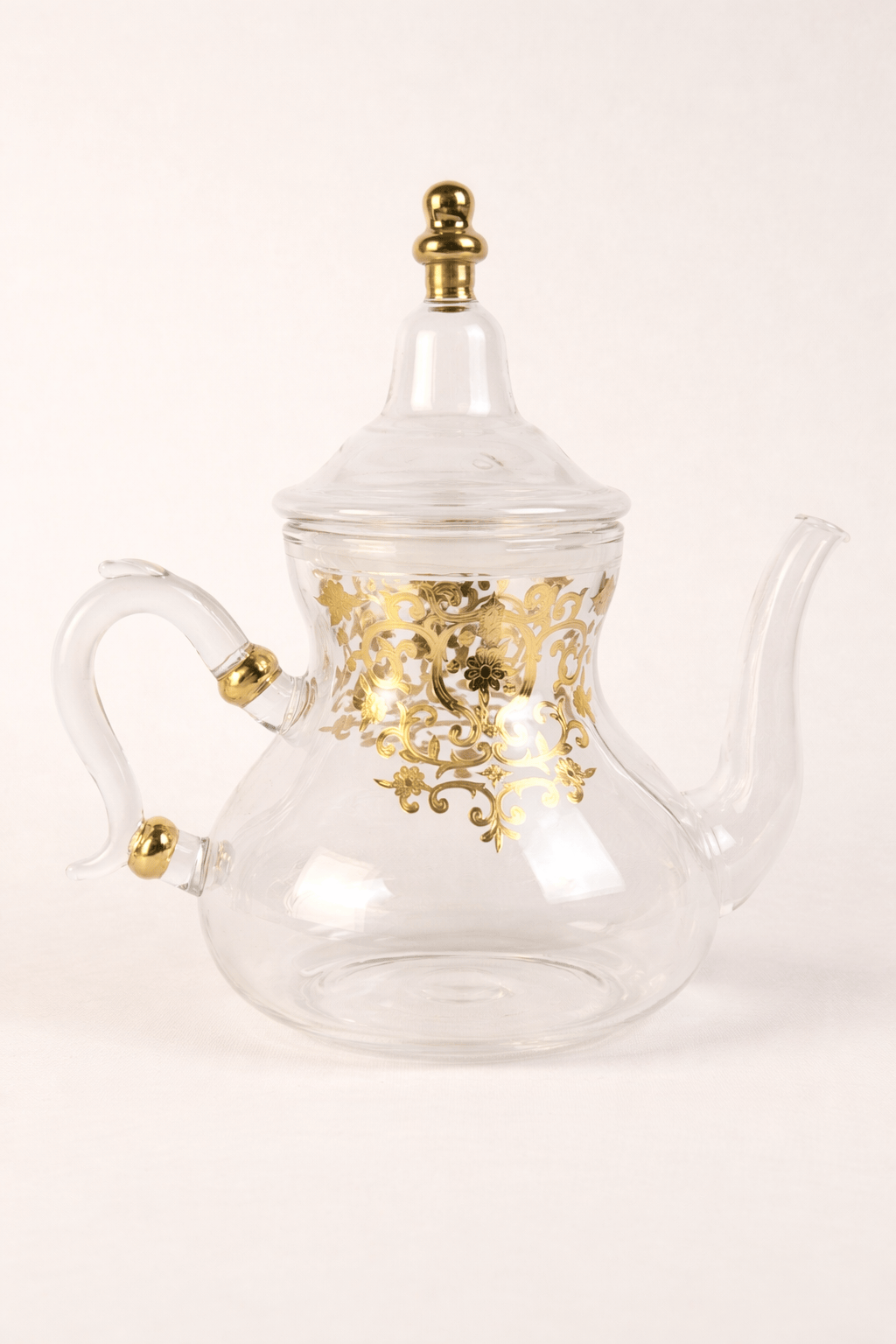 Théière élégante Rabat en verre transparent avec finitions dorées - Home de Luxe France 