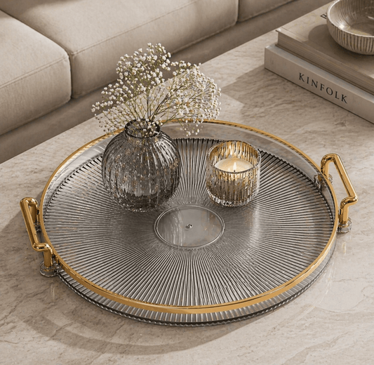 Plateau décoratif rond en plastique de la marque HomeDeLuxe, surface lisse et design moderne pour décoration intérieure.